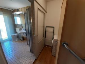 a small bathroom with a toilet and a sink at Ferienwohnungen Irmgard Mori in Sankt Kanzian