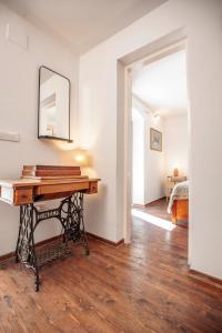 a room with a table and a mirror on the wall at Central Art House Hvar in Hvar