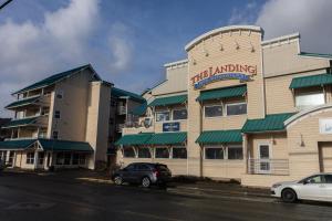 a hotel building with a car parked in front of it at The Landing Hotel in Ketchikan