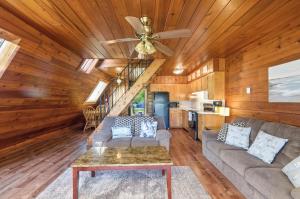 a living room with a couch and a ceiling fan at Chalet 71 in Stevensville