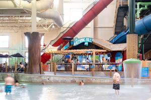 a water park with people playing in the water at Great Wolf Lodge Waterpark Resort in Niagara Falls