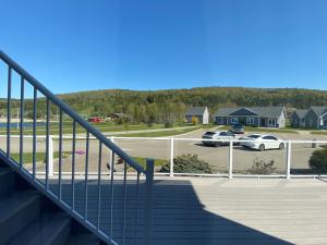 a stairway leading to a parking lot with a car at The Lakes at Ben Eoin Golf Club & Resort in Big Pond