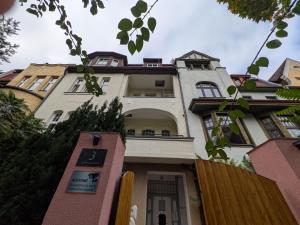a building with a fence in front of it at Hostelion in Magdeburg