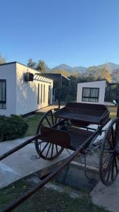 a horse drawn carriage in front of a building at Casa María - Sanagasta in Villa Bustos