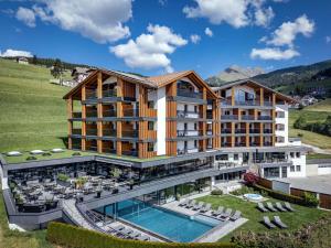 an aerial view of a hotel with a swimming pool at Hotel Edelweiss in Maranza