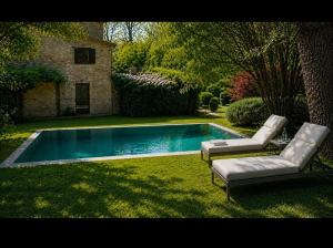 a swimming pool with two lounge chairs next to it at Casale Montone , villa with private pool in Montone