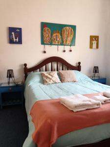 a bedroom with a bed with towels on it at LosCardones in Cafayate