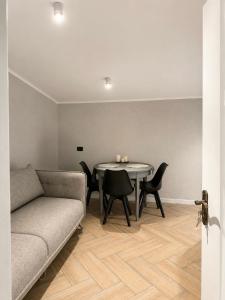 a living room with a couch and a table at ZWIN Apartment 4 in Skole
