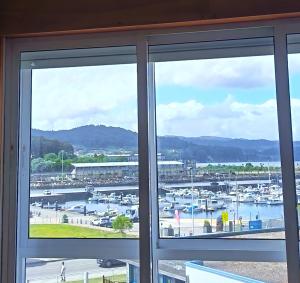 a view of a harbor from a window at Viveiro Centro con Vistas in Viveiro