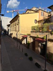 an empty street in a city with a building at La Casa di Peppe in Rieti
