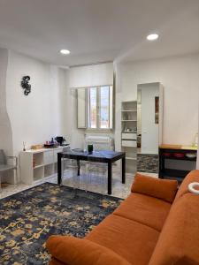 a living room with a couch and a table at La Casa di Peppe in Rieti