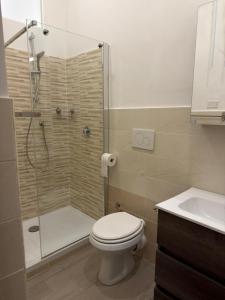 a bathroom with a shower and a toilet and a sink at La Casa di Peppe in Rieti +9 photos
