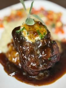 a piece of food on a plate with sauce at The Grenville Hotel and Restaurant in Bay Head +18 photos
