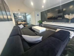 a living room with a couch and a table at CasaNova in Cologne