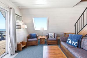 a living room with two chairs and a couch at Chalet #20 in Stevensville