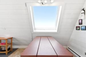 a bench in a room with a window at Chalet #20 in Stevensville