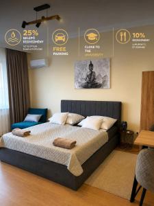 a bedroom with a large bed in a room at Harmónia Home in Miskolc