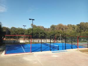 a tennis court with two tennis courts at Villa comfort in Bouznika