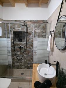 a bathroom with a shower and a sink at Villa Natural View in Moutsoúna