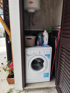 a washer and dryer inside of a house at La Casina Procchio loc I Marmi in Procchio