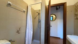 a bathroom with a shower and a sink at Casa Irene in Marina di Massa +13 photos