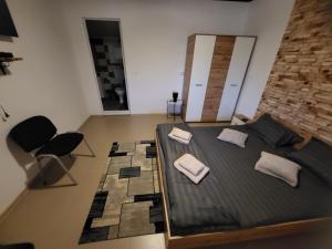 a bedroom with a bed with two pillows on it at Casa Claudiu in Eşelniţa