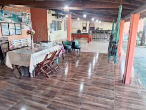 a dining room with a table and chairs in a building at Hospedagem Aconchego Do Lar in Barreirinhas +37 photos