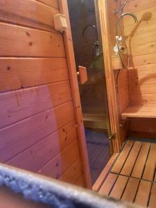 an inside view of a sauna in a wooden cabin at Leśna Stodoła in Siennica +38 photos