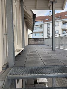a bench sitting on a balcony of a building at Boardinghouse Rheinfelden 4 in Rheinfelden