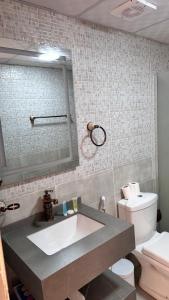 a bathroom with a sink and a toilet at SaLem rum in Wadi Rum +27 photos