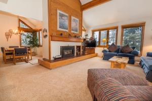 a living room with a couch and a fireplace at Quicksilver #1602 in Keystone +39 photos