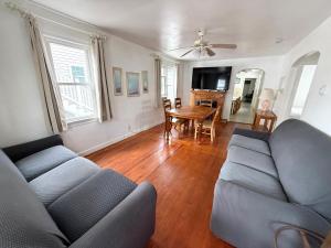 a living room with a couch and a table at Sea Kist Motel in Wildwood