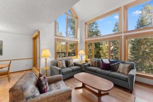 a living room with a lot of windows at Quicksilver #1631 in Keystone