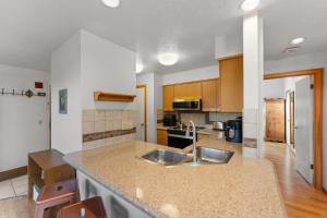 a kitchen with a sink and a counter top at Quicksilver #1631 in Keystone +31 photos