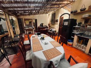 a dining room with a table and chairs and a fireplace at Coliving Granada in Envigado +42 photos