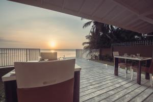 a restaurant on the beach with a view of the ocean at Hush Lagoon 30 in Negombo