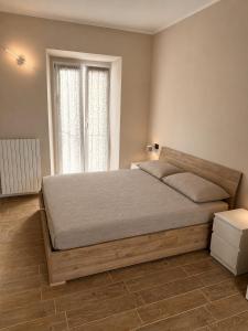 a bedroom with a bed and a window at La Terrazza, comfort e relax tra i laghi in Borgomanero