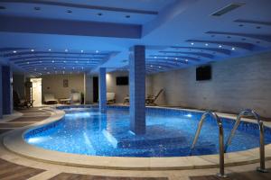a large swimming pool in a hotel room at Hotel Rozaje in Rožaje
