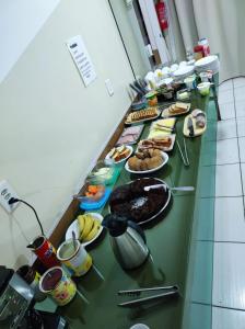 a buffet line with many different types of food at Hotel Jacaré in Ituporanga +14 photos