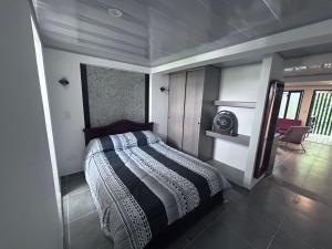 a bedroom with a bed in a room at Park Suite in Ibagué
