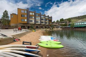 a bunch of surfboards are lined up on the beach at Flying Dutchman #1158 in Keystone