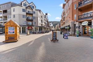 an empty street in a town with buildings at Flying Dutchman #1158 in Keystone +24 photos
