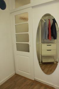 a room with a mirror and a closet at Casa Beco Do Castelo in Lisbon