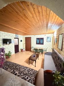 a living room with a couch and a table at Villa Adi in Ducaj