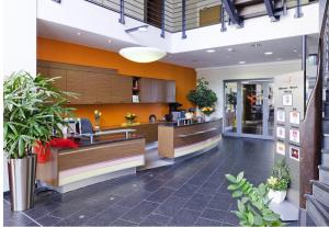 a lobby of a store with plants in it at Phönix Hotel in Bergneustadt