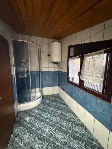 a bathroom with a shower and a toilet in it at Hotel Laura in Velipojë +24 photos