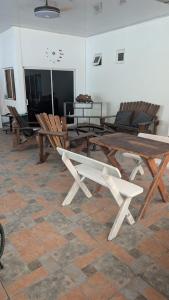 a large wooden table and chairs in a room at WinMen in El Sunzal
