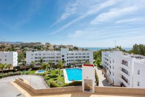 an apartment with a swimming pool and buildings at APARTAMENT MIJAS BEACH, ÁNGEL in La Cala de Mijas +17 photos