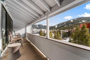 a balcony with a view of a mountain at Snowbridge Square #F206 in Copper Mountain