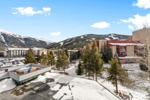 an aerial view of a resort in the snow at Snowbridge Square #F206 in Copper Mountain +23 photos